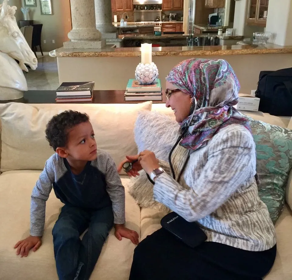 Dr. Bitar caring for a patient at home